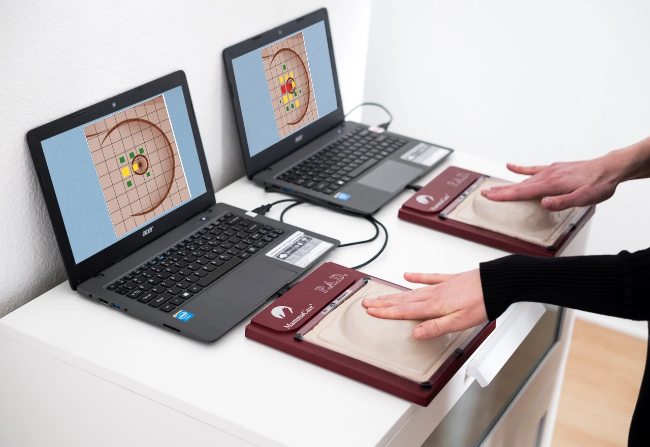 Two healthcare providers completing AI-guided breast exam training