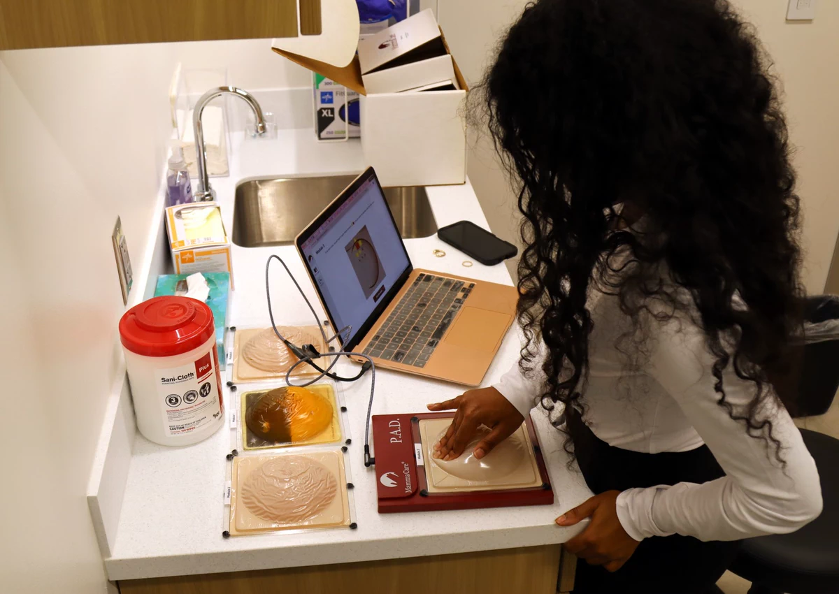 Trainee using the AI Breast Exam Trainer